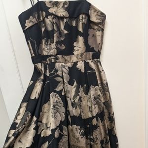 Xscape black and gold gown